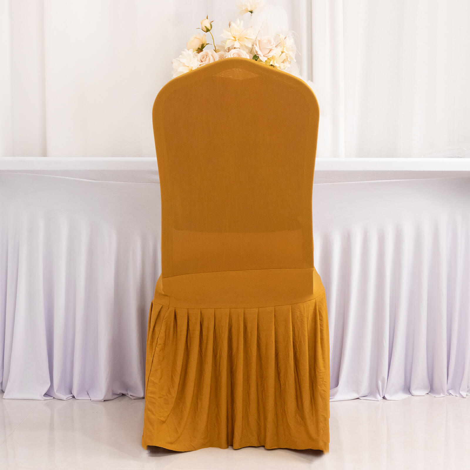 Gold ruffle pleated chair slipcover for elegant banquet settings.