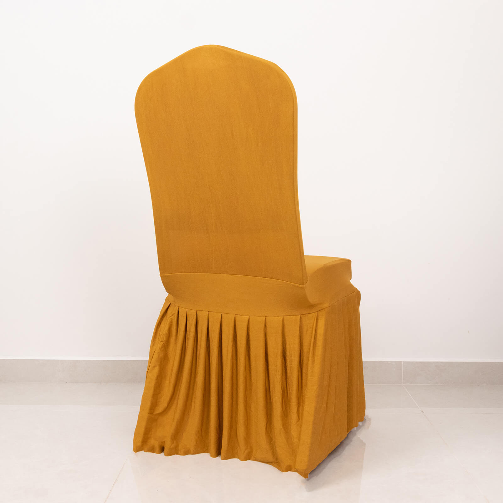 Gold ruffle pleated chair slipcover in a fitted design.
