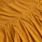 Gold ruffle pleated skirt banquet chair slipcover in a warm golden hue.