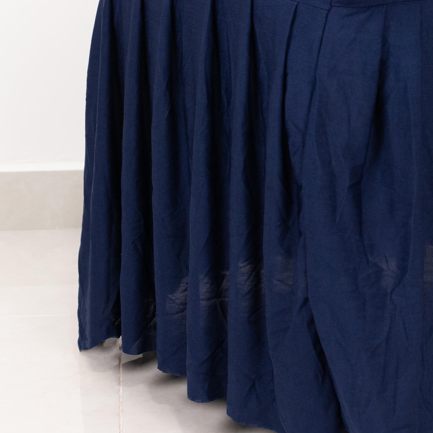 Navy ruffle pleated spandex chair slipcover for banquet seating.