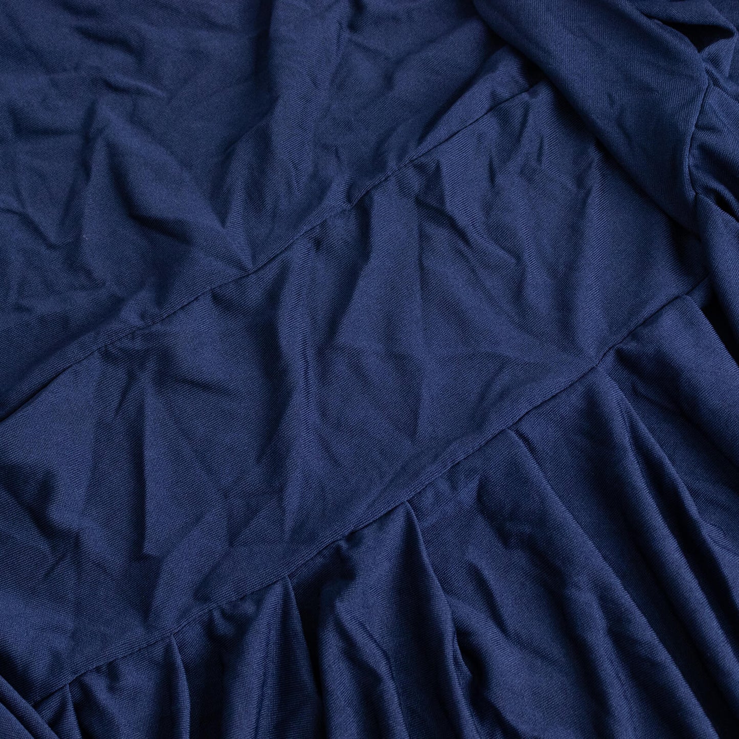 Navy ruffle pleated spandex chair slipcover for banquet seating.