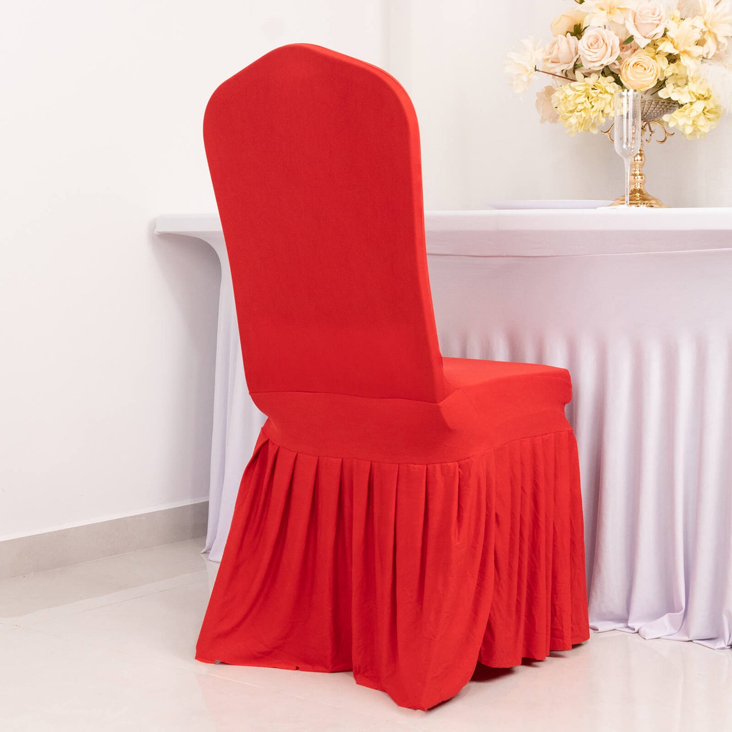 Red ruffle pleated spandex chair slipcover for banquet seating.