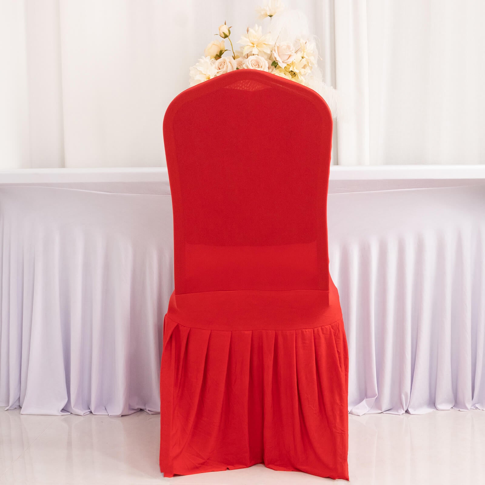 Red ruffle pleated chair slipcover for banquet settings.