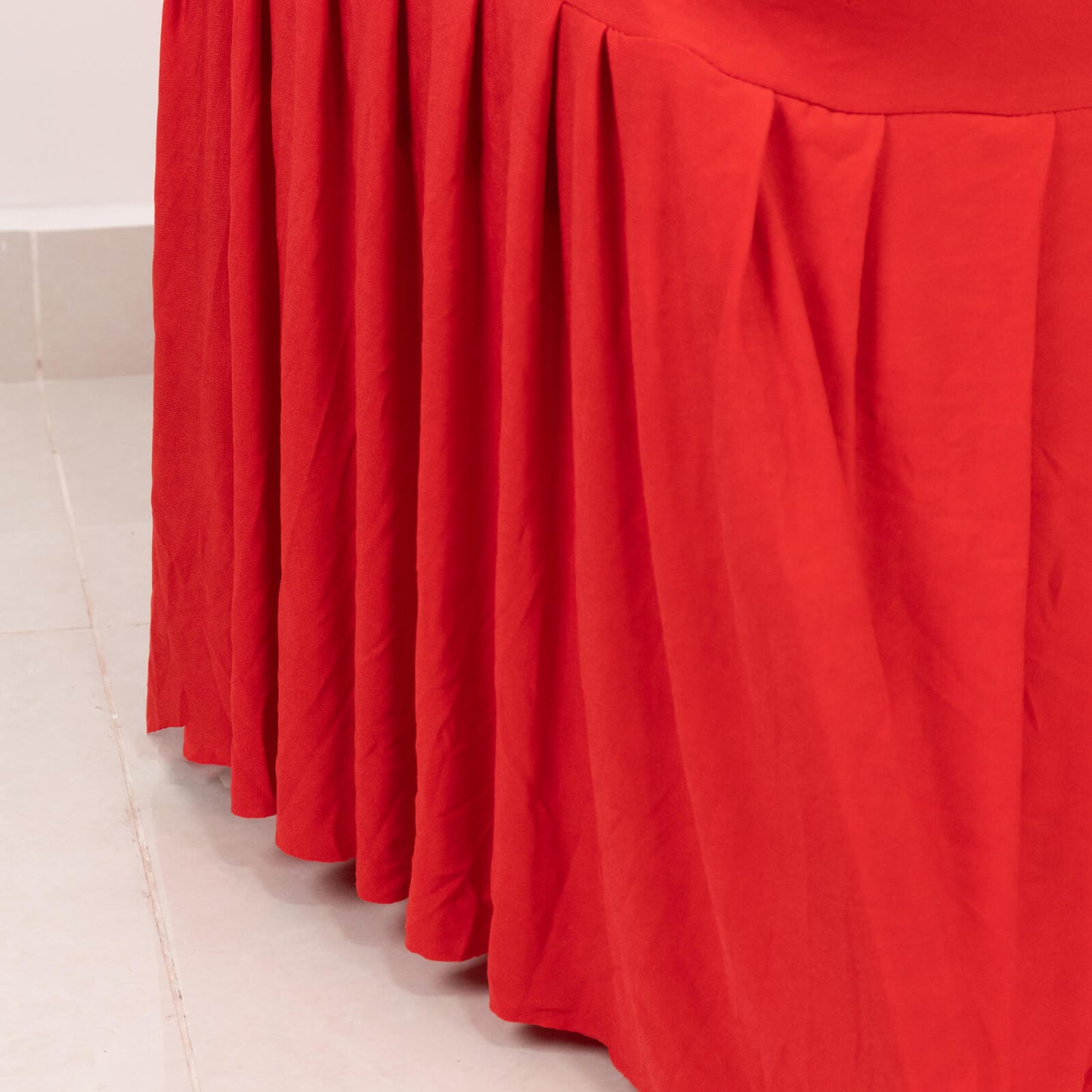 Red ruffle pleated skirt chair slipcover in vibrant red.