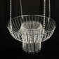 Clear acrylic crystal chandelier cake stand with hanging bead chains.