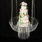 25" Acrylic Crystal Chandelier Wedding Cake Stand with pink flowers and beads.