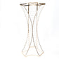 Gold and crystal hourglass flower stand for floral arrangements.