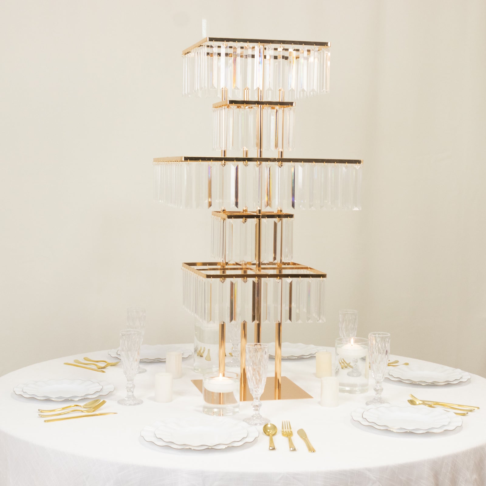 Gold crystal pendant table centerpiece with hanging crystals.