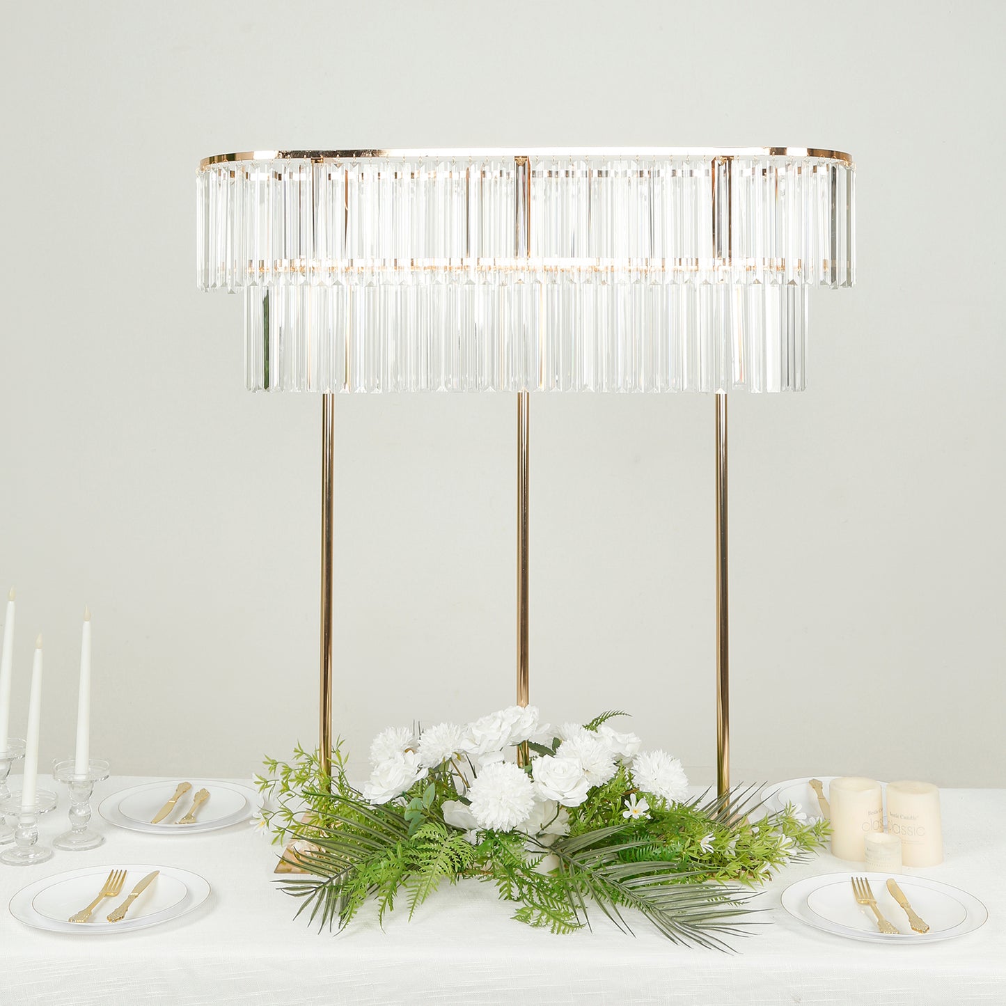 Gold crystal pendant flower stand centerpiece with drop accents.