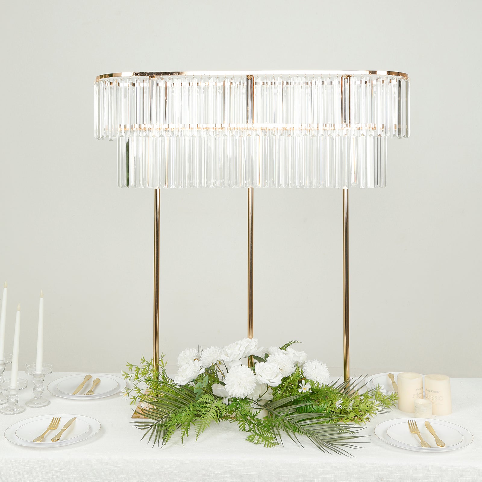 Gold crystal pendant flower stand centerpiece with drop accents.