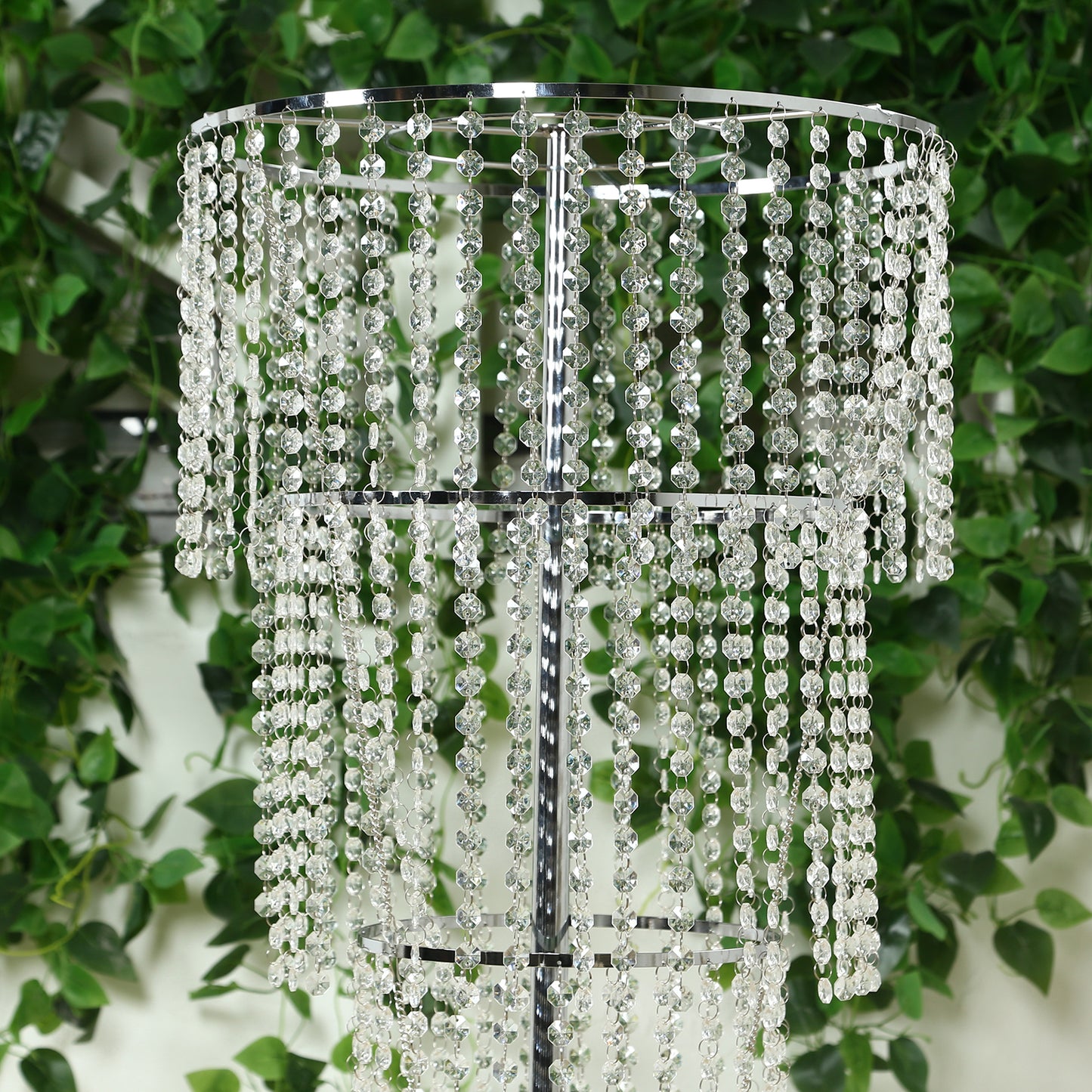 Clear acrylic beaded chandelier centerpiece for elegant table decor.