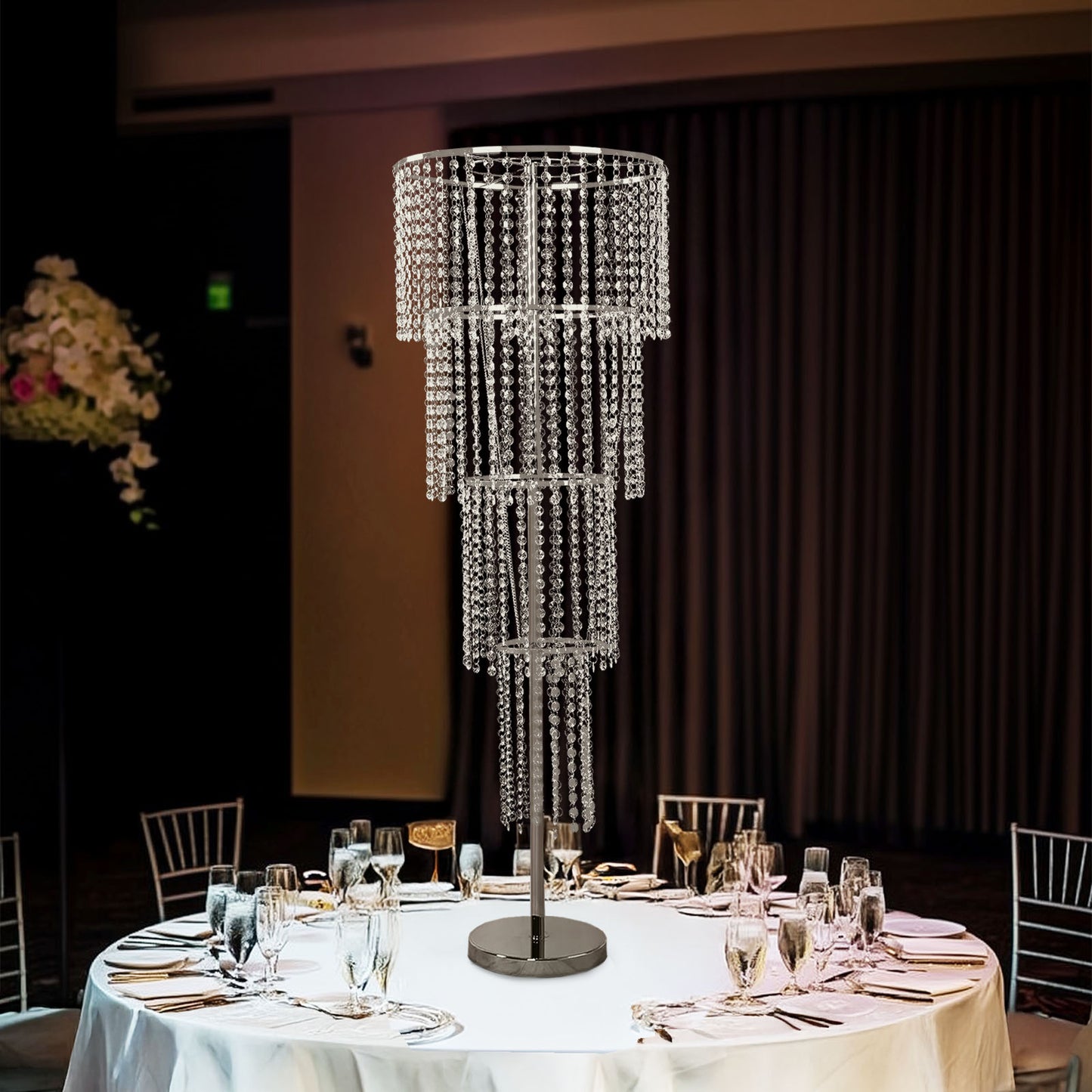Clear acrylic beaded chandelier centerpiece for elegant wedding table decor.