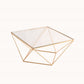Gold geometric cake stand with glass top centerpiece display.