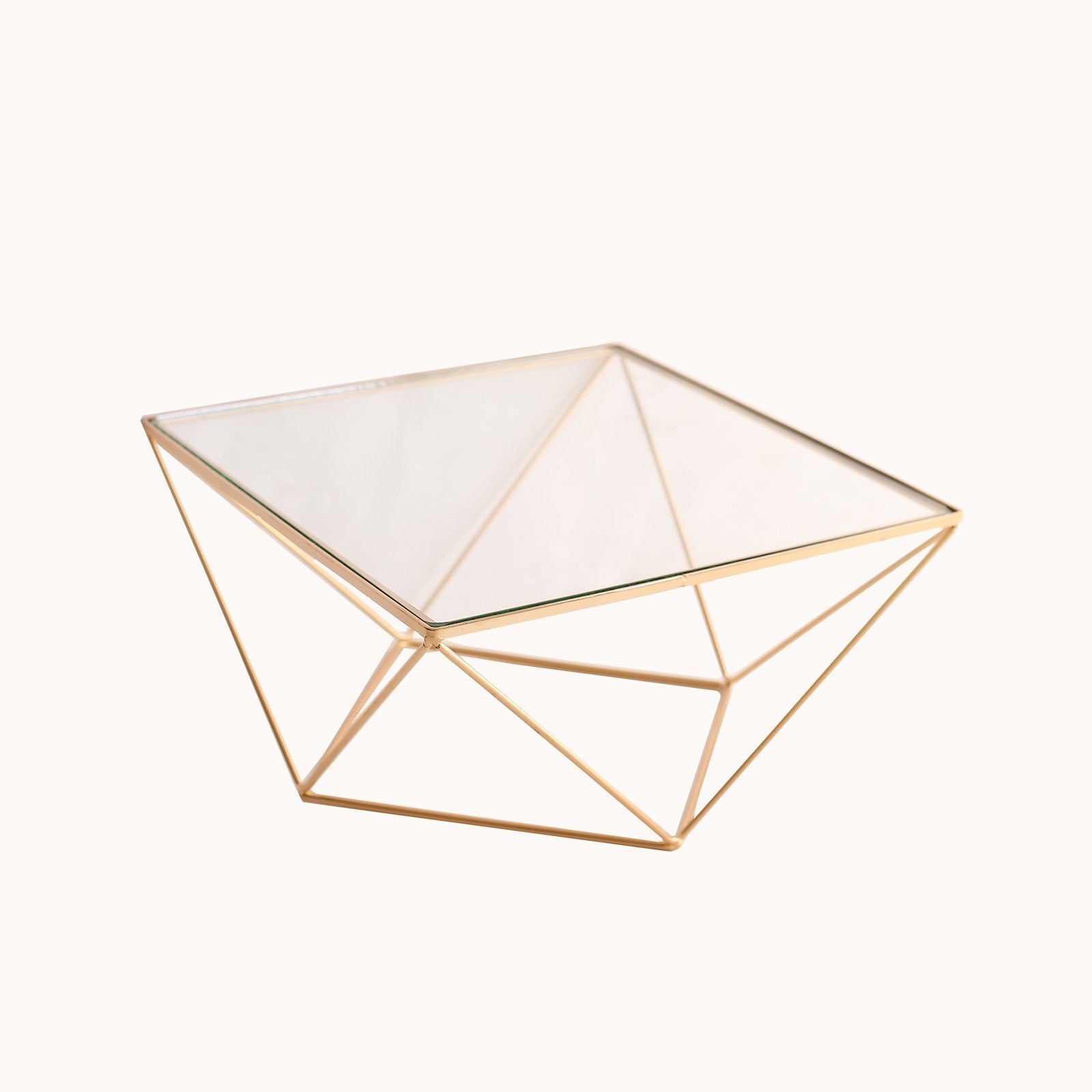 Gold geometric cake stand with glass top centerpiece display.