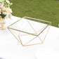 Gold geometric cake stand with square glass top centerpiece display.