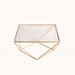 Gold metal geometric cake stand with square glass top.
