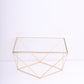 Gold metal geometric stackable dessert stand with square glass top.