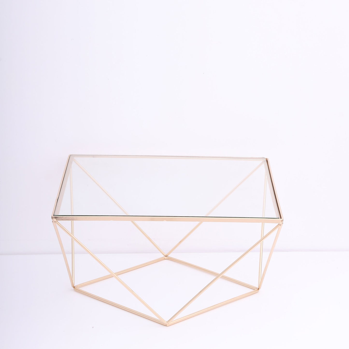 Gold metal geometric stackable dessert stand with square glass top.