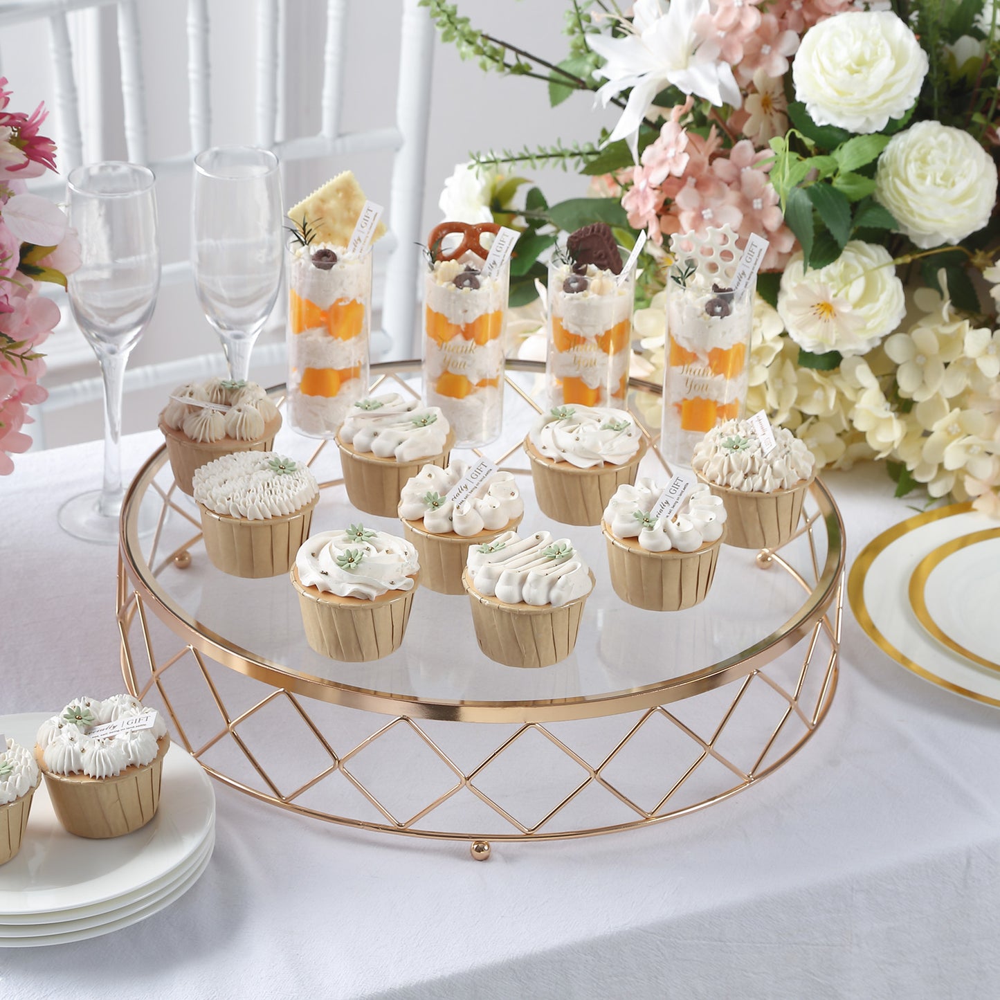 Gold geometric diamond cut cake stand displaying assorted desserts.