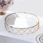 Gold geometric diamond cut cake stand with glass top.