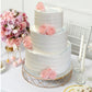 Gold geometric cake stand with glass top, perfect for dessert display.