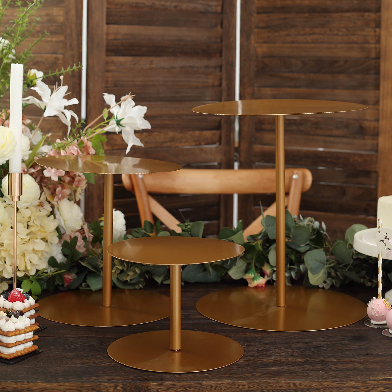 Gold metal round pedestal cupcake stands in three sizes, perfect for dessert displays.