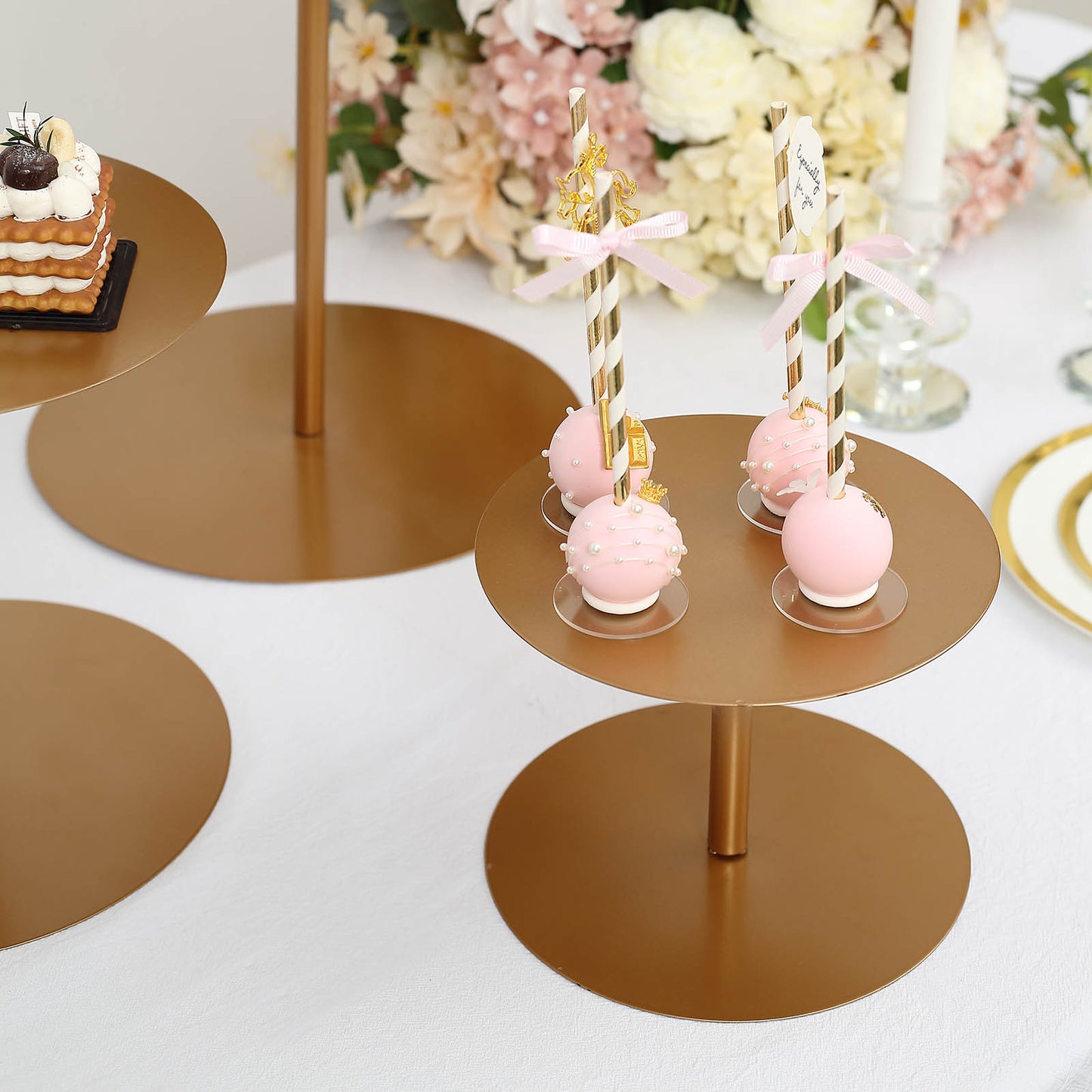 Gold metal round pedestal cupcake dessert stands for cake display.