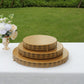 Gold metal Fleur De Lis cupcake dessert display stand on a white table.