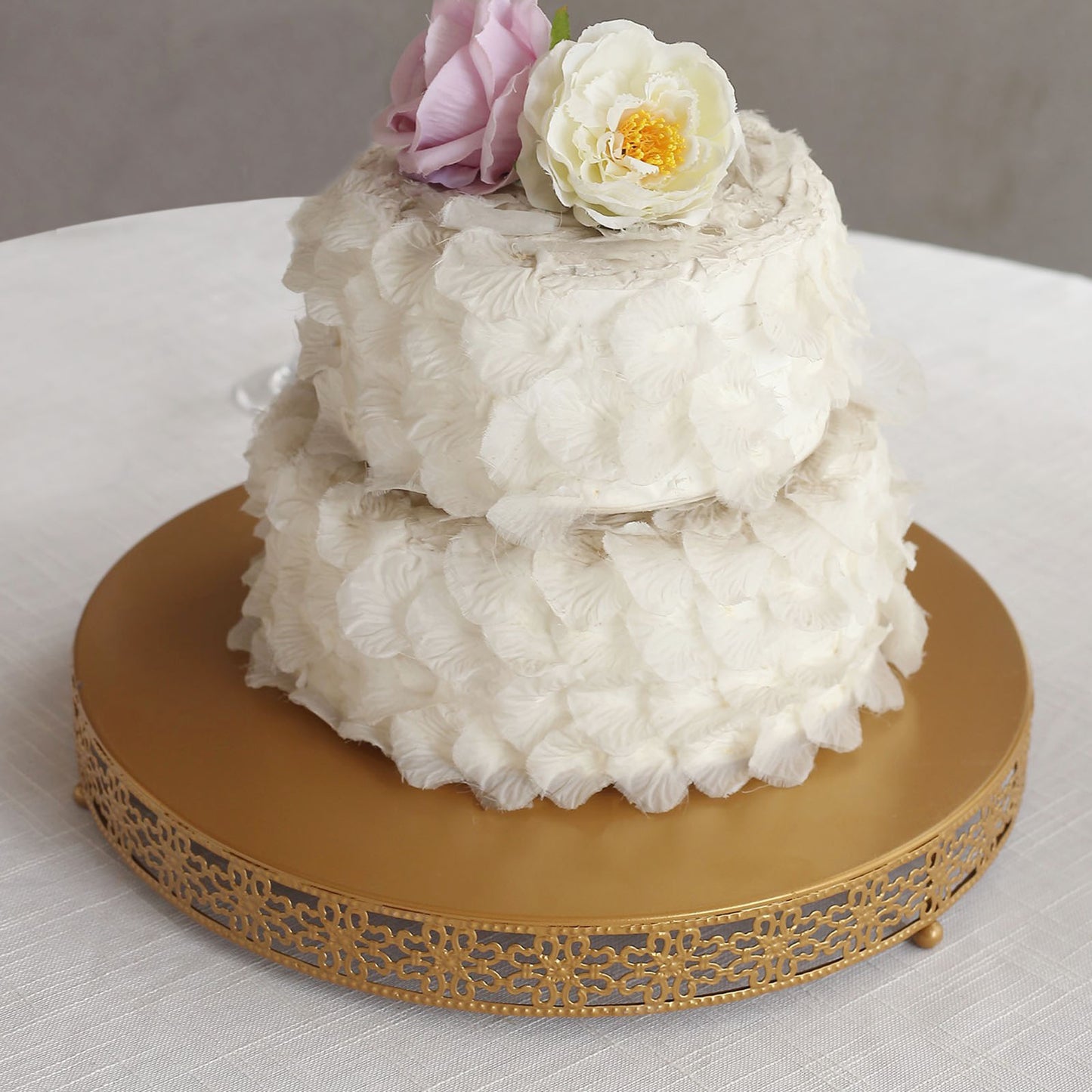 Gold metal Fleur De Lis cupcake stand with a round pedestal for desserts.