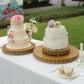 Gold metal fleur de lis cupcake stand with round pedestal design.