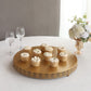 Gold metal Fleur De Lis cupcake stand displaying desserts.