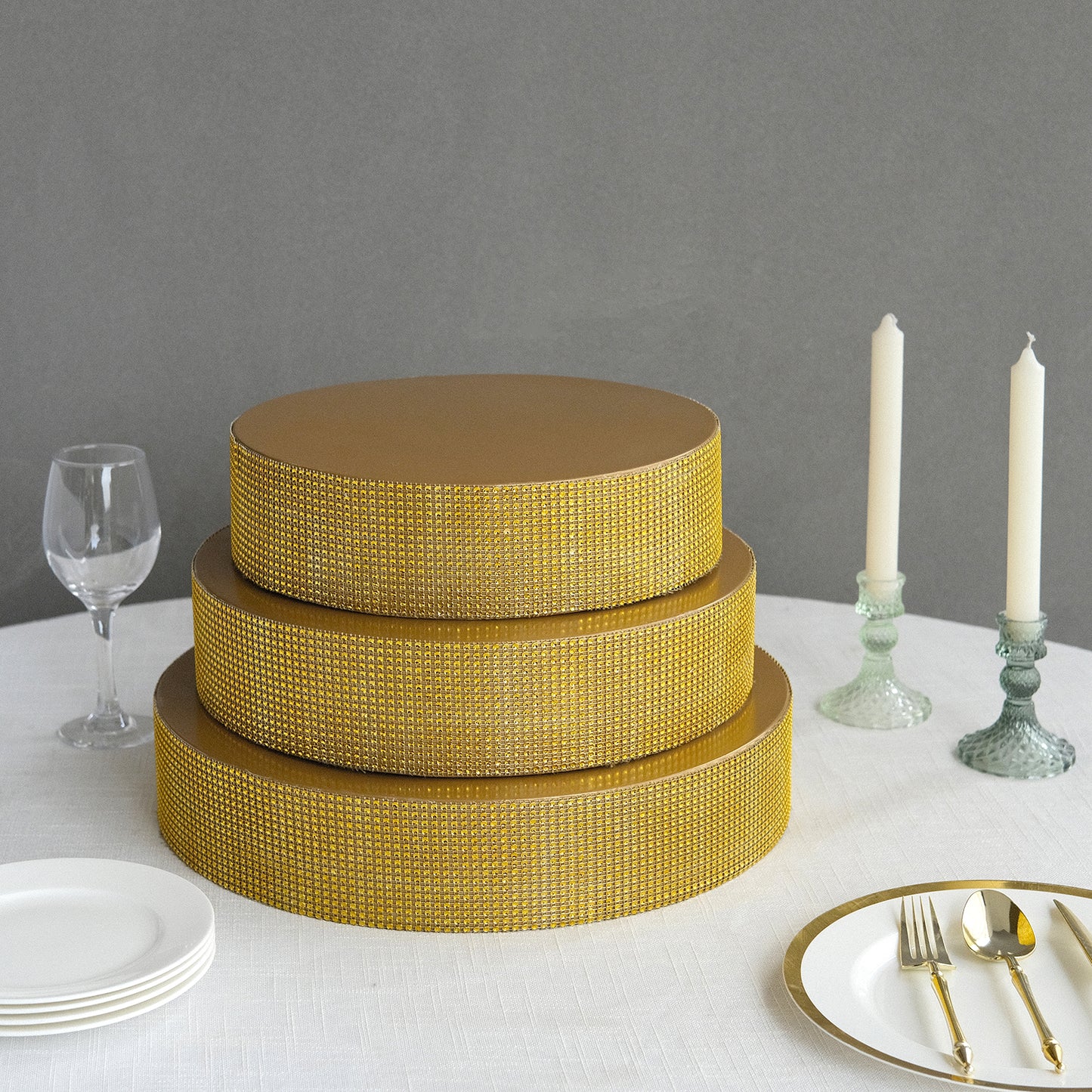 Gold rhinestones round metal cake stand centerpiece.