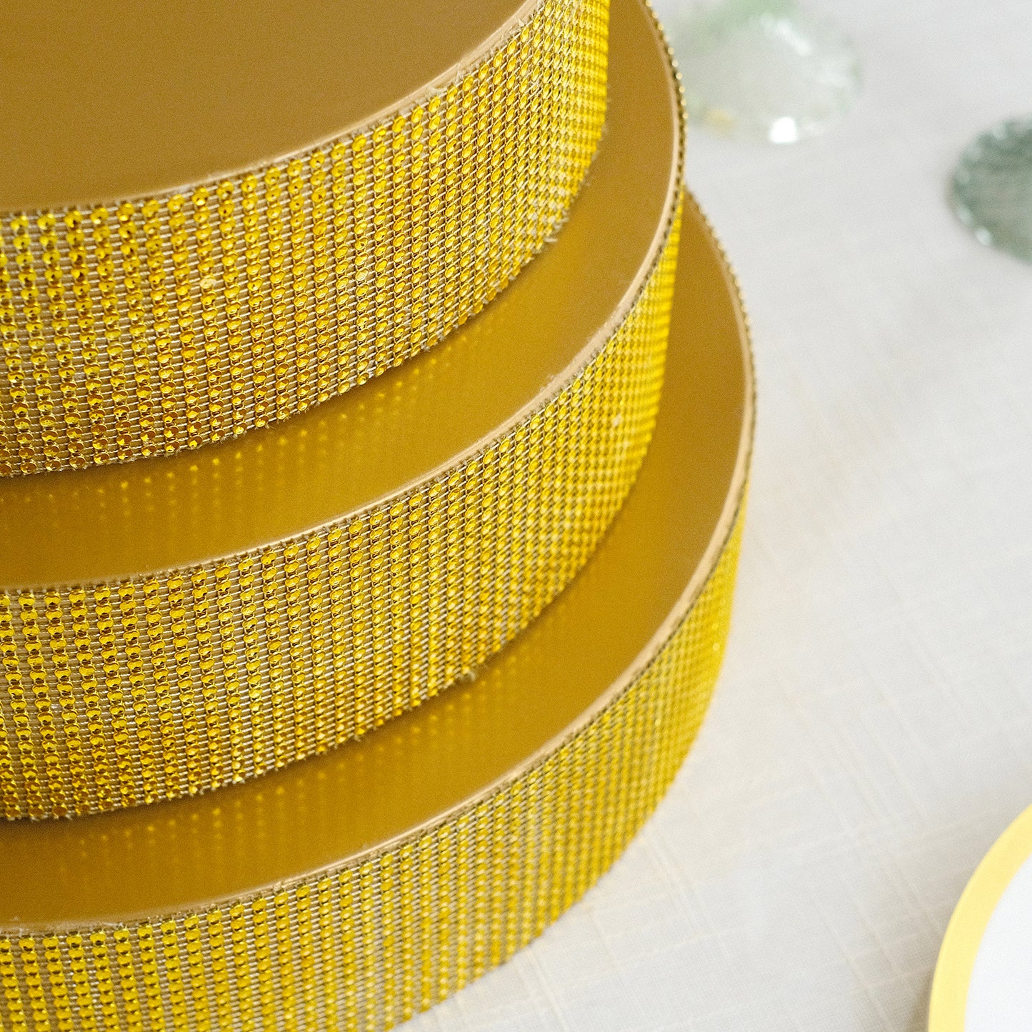 Gold rhinestone round metal pedestal cake stand.