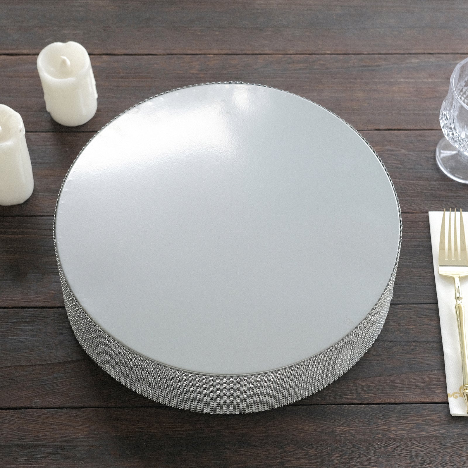 Silver round metal pedestal cake stand with rhinestones.
