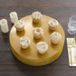 Gold round metal pedestal cake stand with cupcakes, ideal for dessert table display.