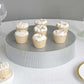 Silver rhinestone round pedestal cake stand with cupcakes.