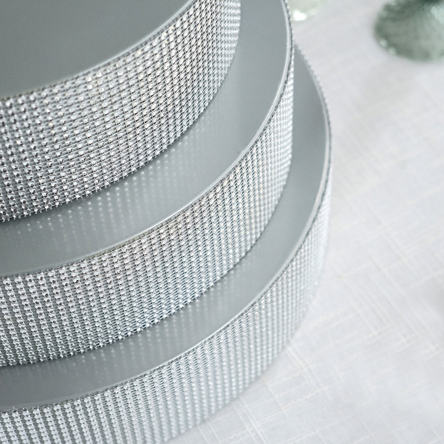 Silver rhinestone round metal cake stand display centerpiece.