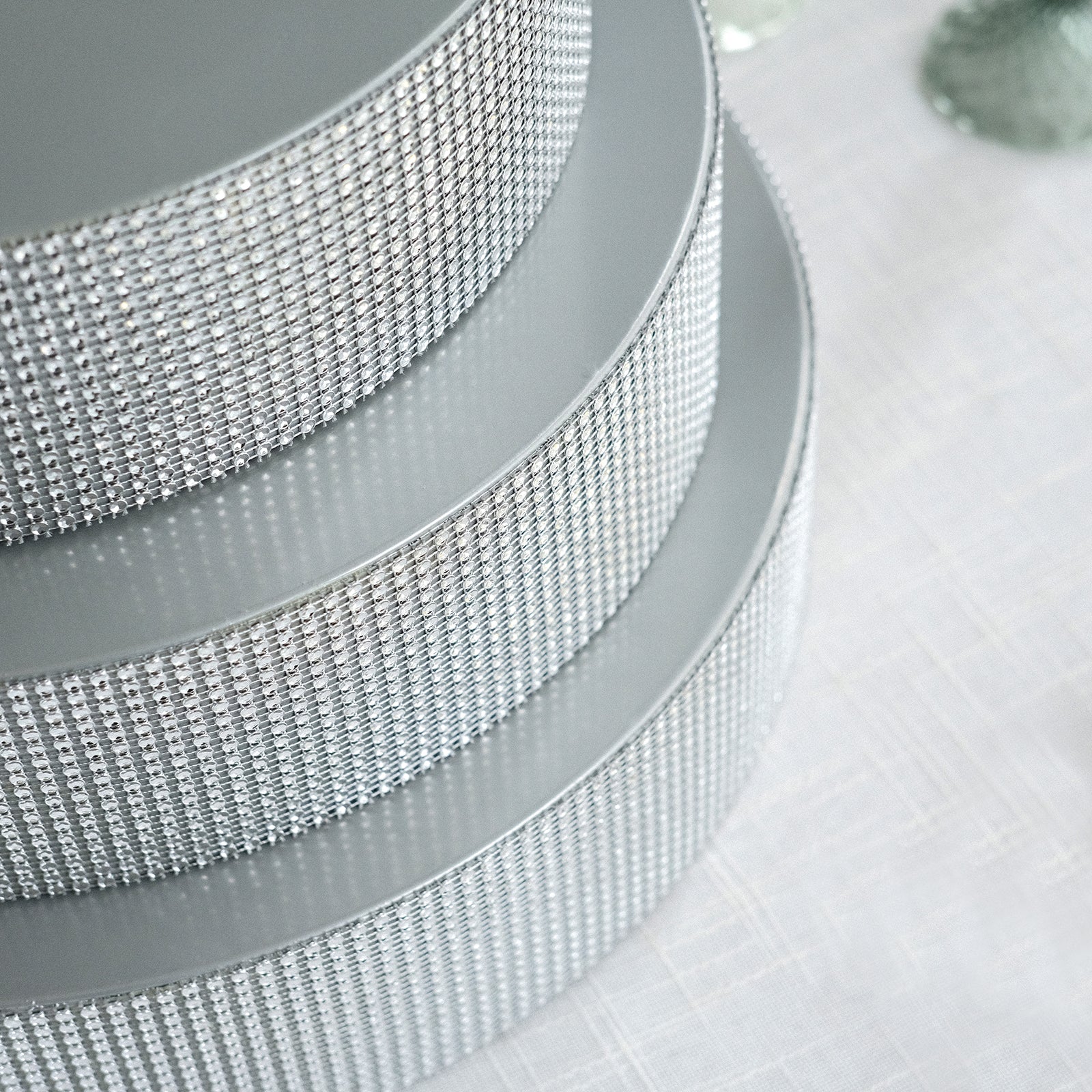 Silver rhinestone round metal cake stand display centerpiece.