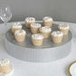Silver round metal pedestal cake stand with cupcakes, perfect for dessert displays.