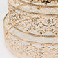 Gold Baroque metal cake stands with glass tops, stackable for desserts.