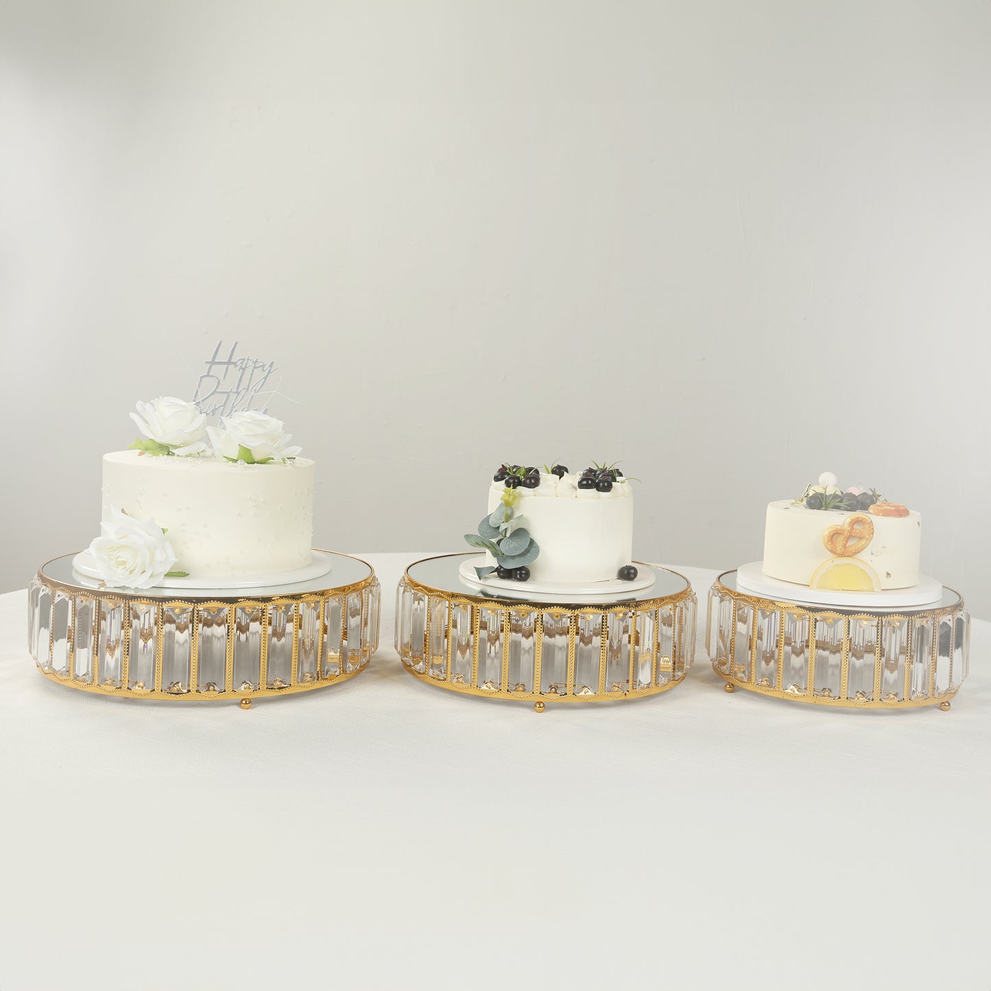 Gold metal crystal pendant cake stands with mirror tops, stackable dessert display trays.