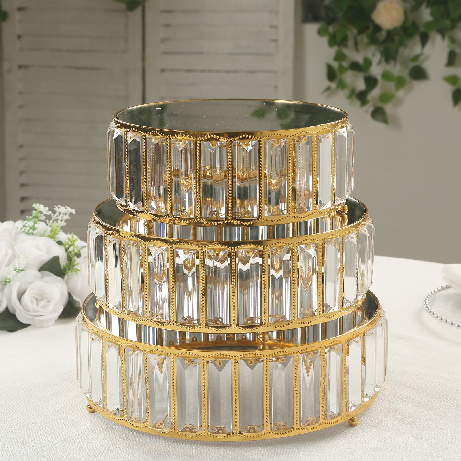 Gold metal crystal pendant cake stands with mirror tops, stackable dessert display trays.