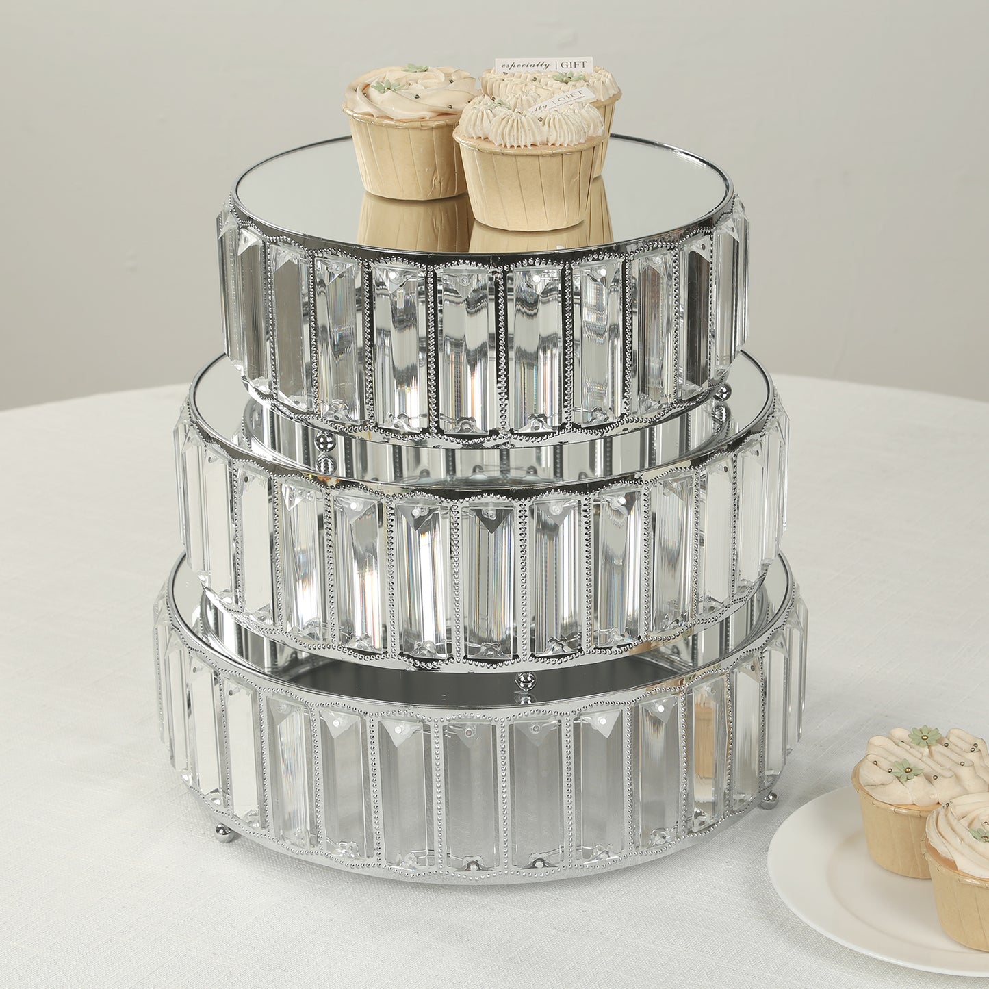 Silver metal crystal pendant cake stands with mirror top, stackable dessert display trays.