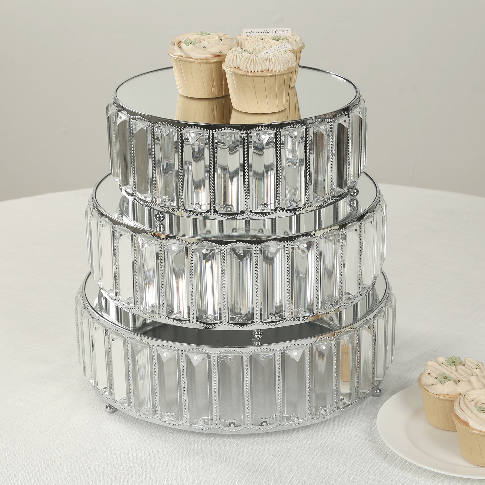 Silver metal crystal pendant cake stands with mirror top, stackable dessert display trays.