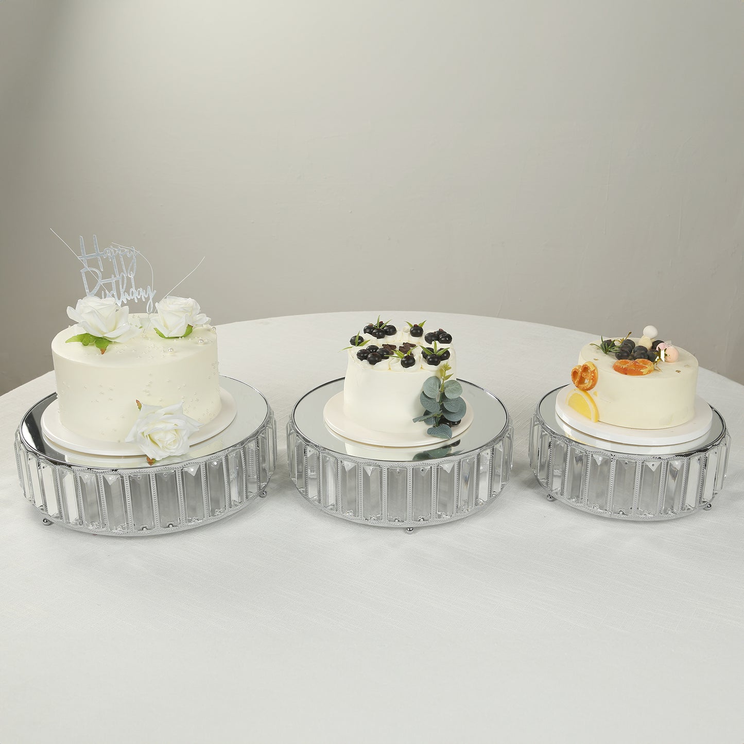 Set of 3 silver crystal pendant cake stands with mirror tops, stackable dessert trays.
