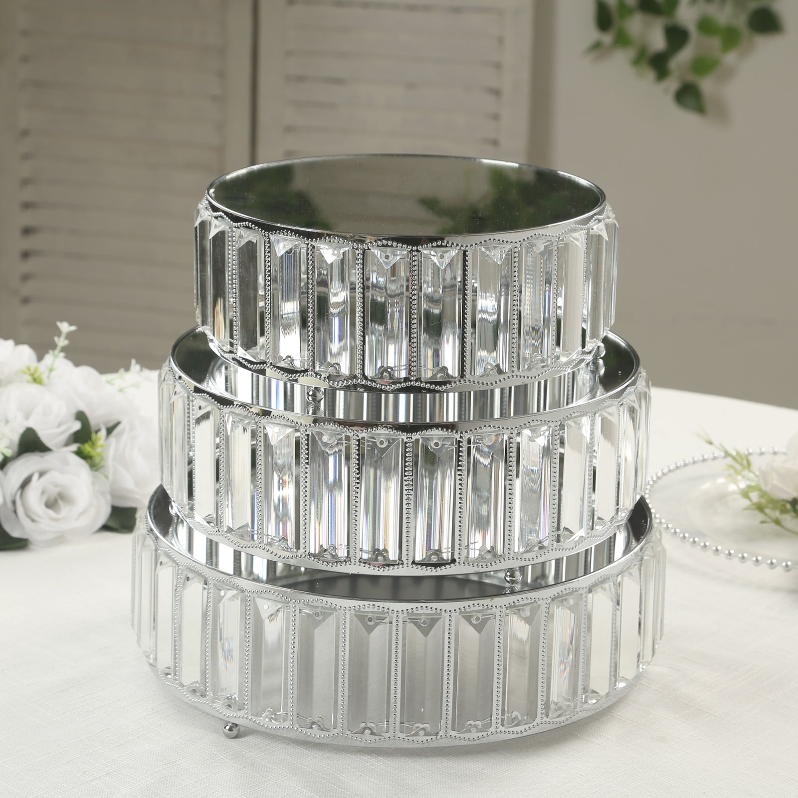 Set of 3 silver metal crystal pendant cake stands with mirror tops.