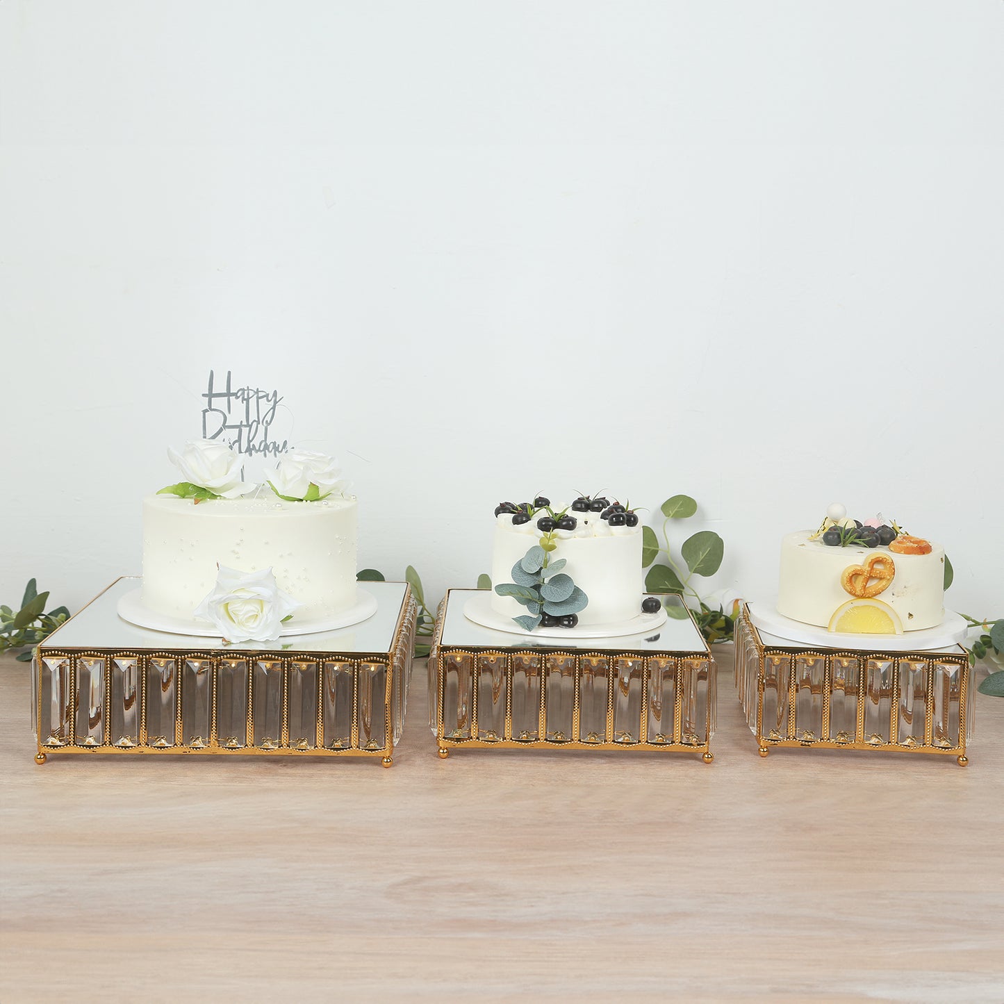 Gold metal crystal pendant cake stands with mirror tops, stackable dessert display trays.
