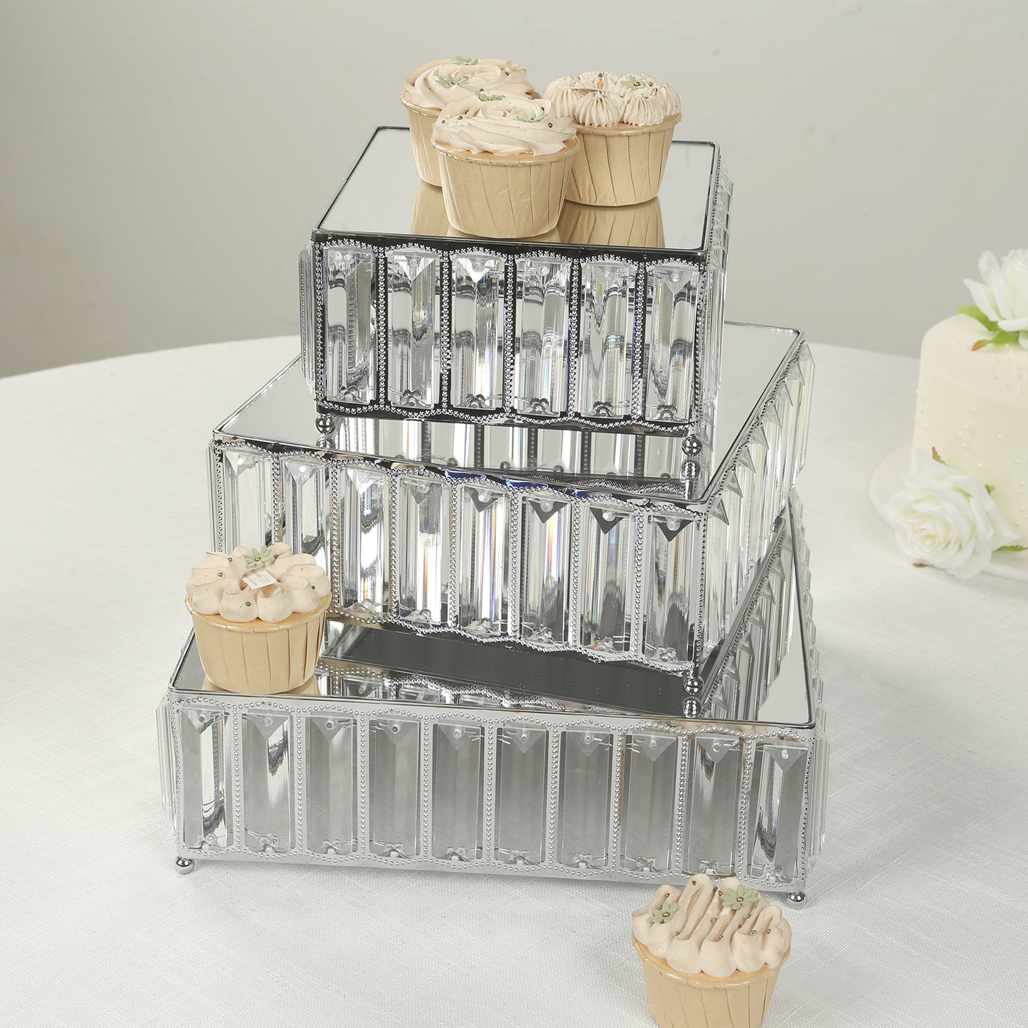 Silver metal crystal pendant cake stands with mirror tops, stackable dessert display trays.