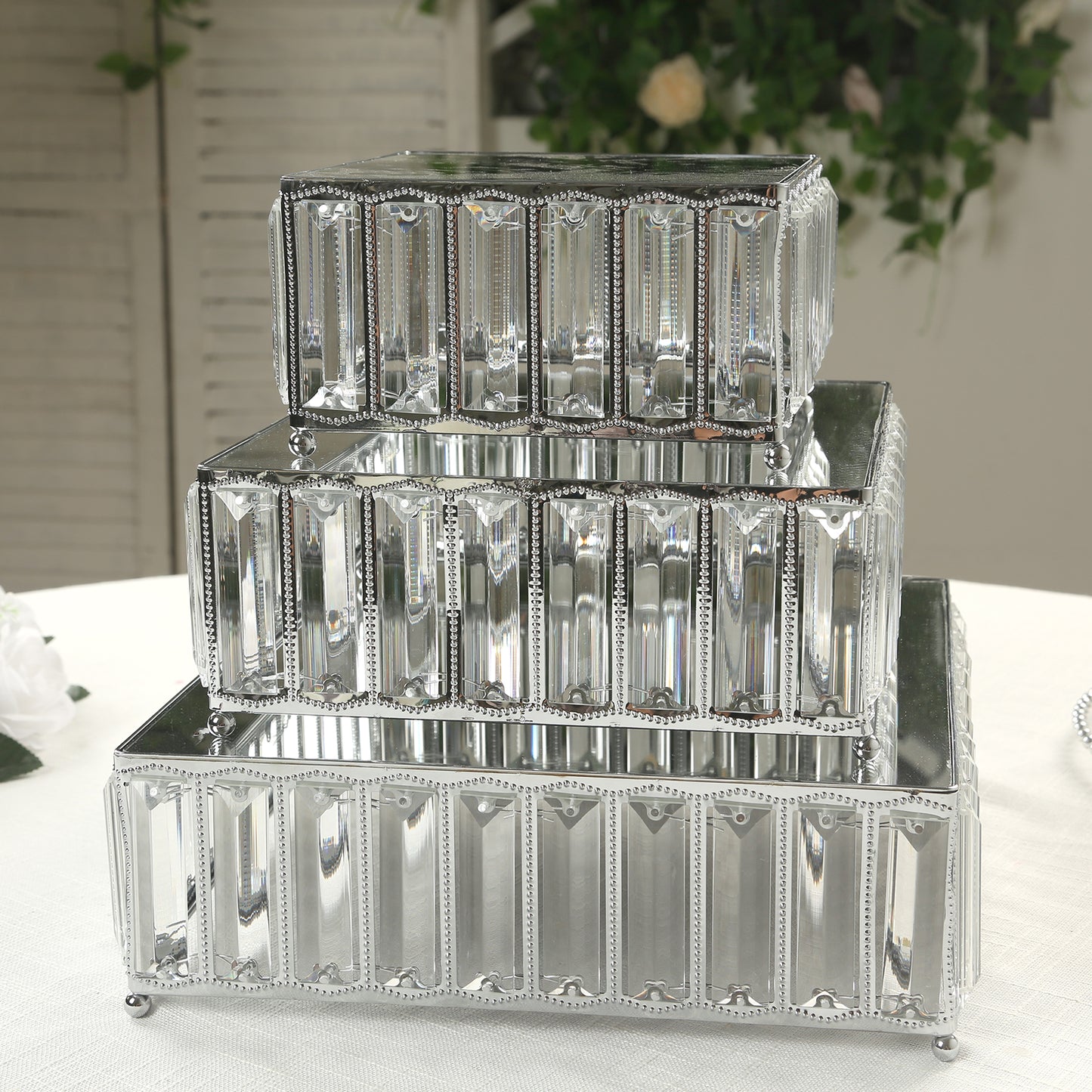 Set of 3 silver crystal pendant cake stands with mirror tops.