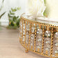 Gold cake stand with hanging crystal beads and glass top.